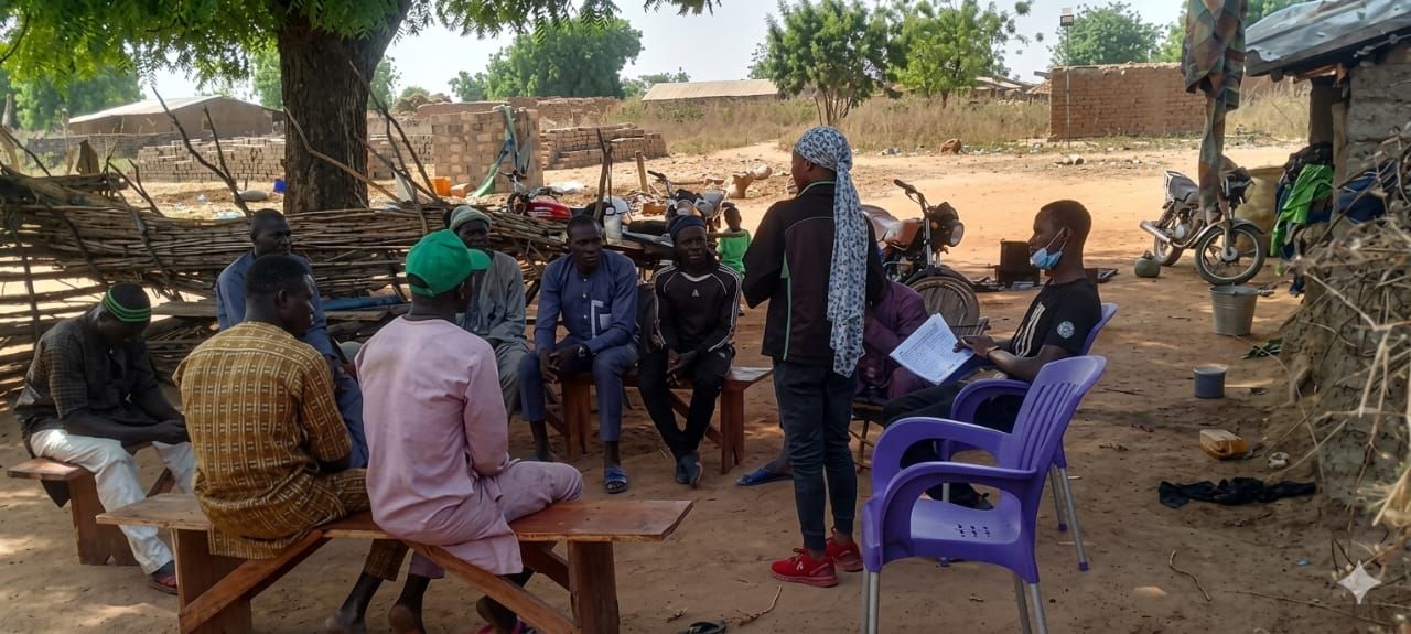 Village meeting in the shade